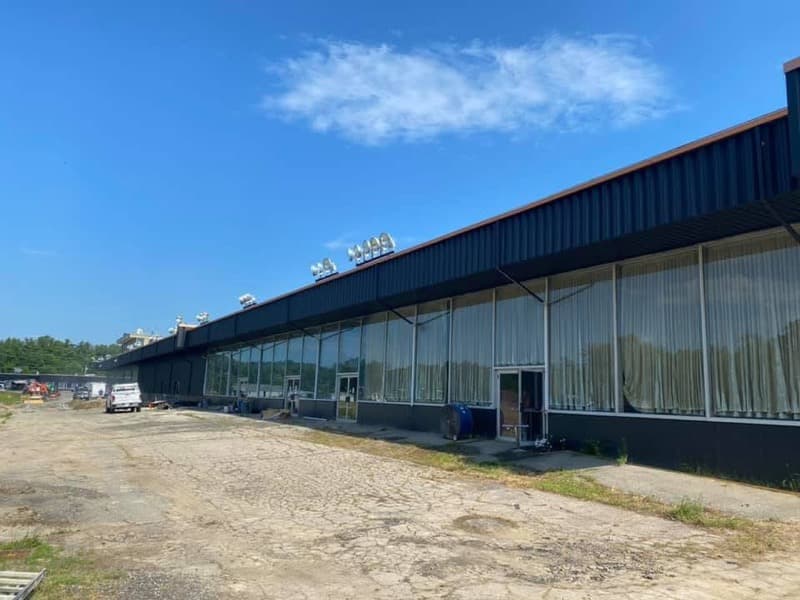 Commercial building exterior painted dark with large glass windows in Seabrook, NH