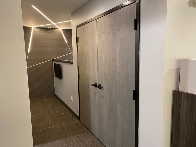 Commercial hallway with modern finishes and linear LED lighting in Salem, NH