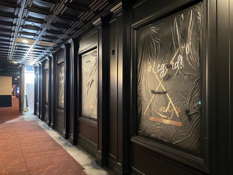 Commercial hallway with black painted wainscoting panels and ornate trim in Seabrook, NH
