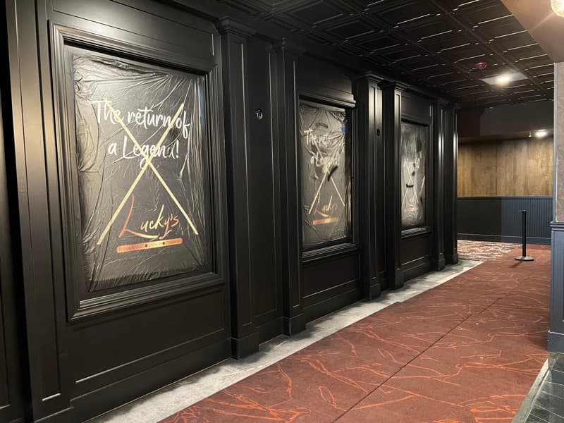 Commercial corridor with black painted panel molding and tin ceiling in Seabrook, NH